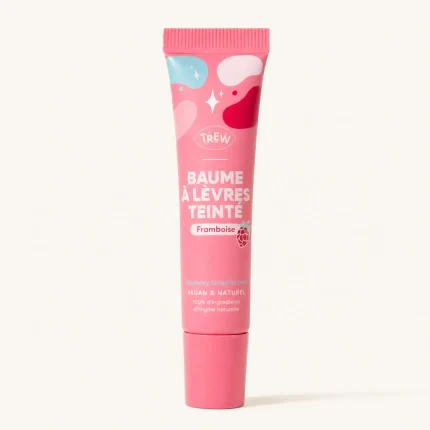 Tube rose Baume à Lèvres Teinté Framboise TREW fond beige