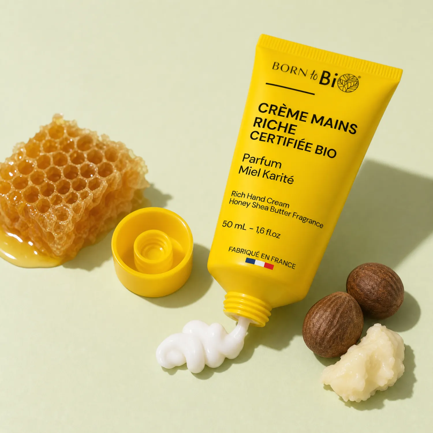 Tube jaune Born to Bio crème mains miel karité texture blanche